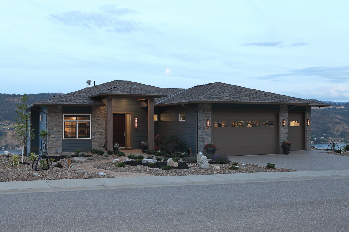 Photo of front entrance with cultured stone and hardi plank siding.