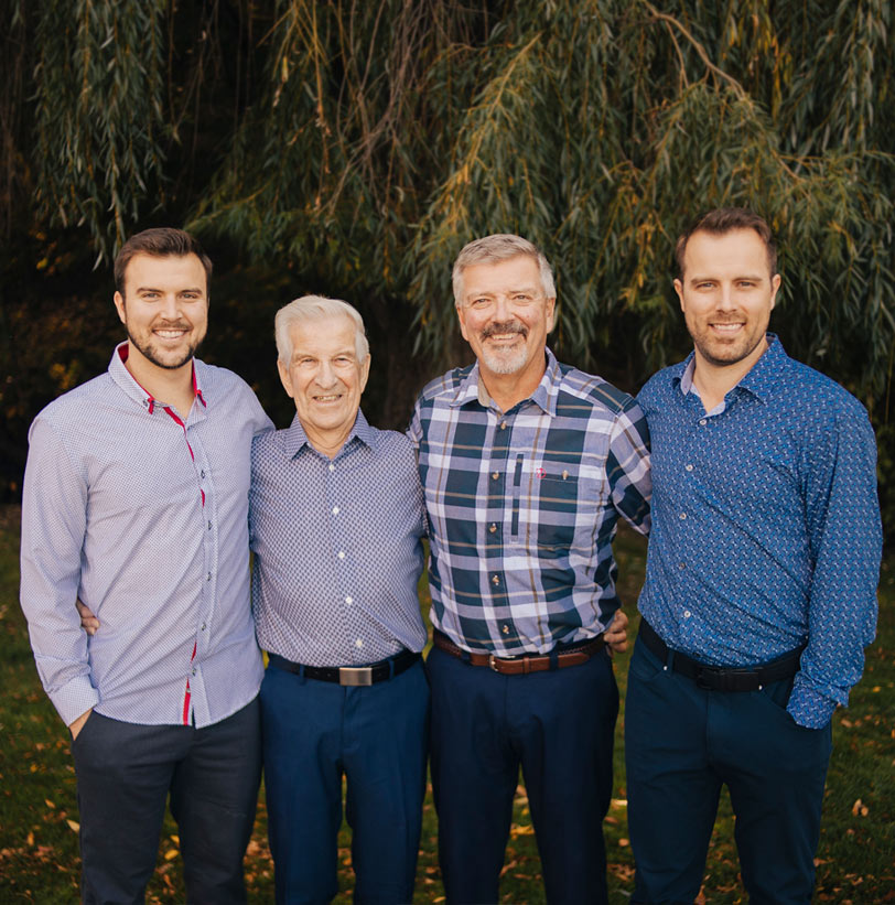 Picture of three generations of Keith Construction men, grandfather, father and son.